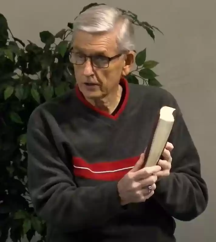Calvin with Bible